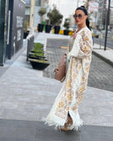 Abaya in lana ricamata in bianco