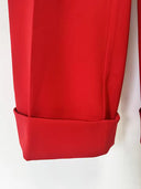 Red blazer and trousers set styled for an evening event