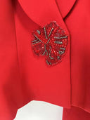 Red high-waisted wide-leg trousers with cuffed hems