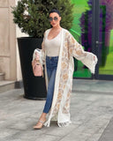 Abaya in lana ricamata in bianco