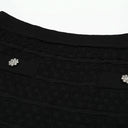Black flared knit skirt with crystal buttons detail