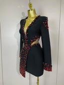 Black plunge mini dress with red crystal embellishment, front view