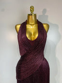 Deep V halter neckline with draped metallic fringe