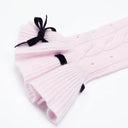 Flared ruffle cuff with black velvet bow