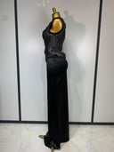 Black fringe top and satin skirt side view