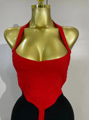 Red and black halter bandage dress styled for an evening event