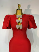 Puff sleeves and crystal bow cut-outs close-up