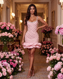 Model wearing the pink crystal ruffle mini bandage dress