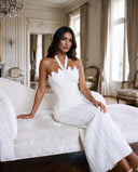 Model wearing the white sculpt beaded gown