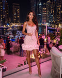 Model wearing the pink crystal ruffle mini bandage dress
